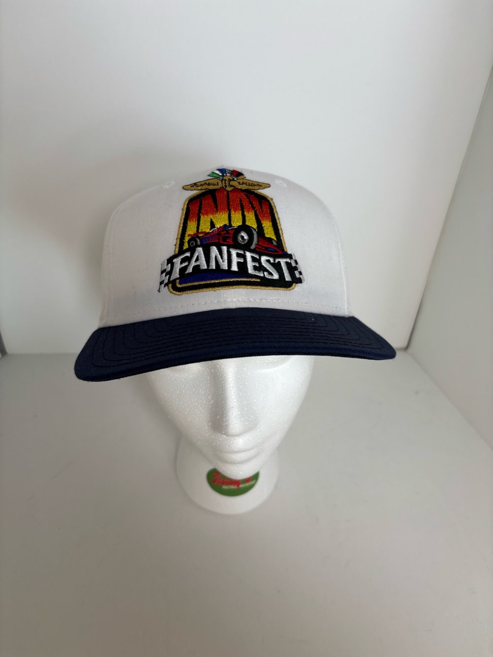 INDY FANFEST white & navy cap with embroidered logo and adjustable strap